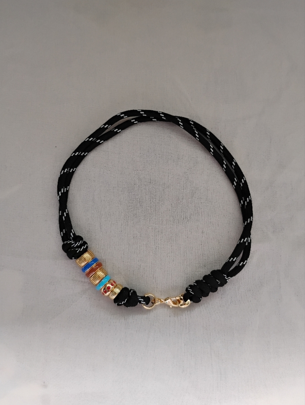 Roxanne Assoulin Black Cord Necklace with Gold, Blue and Red Beads - Picture 3 of 3